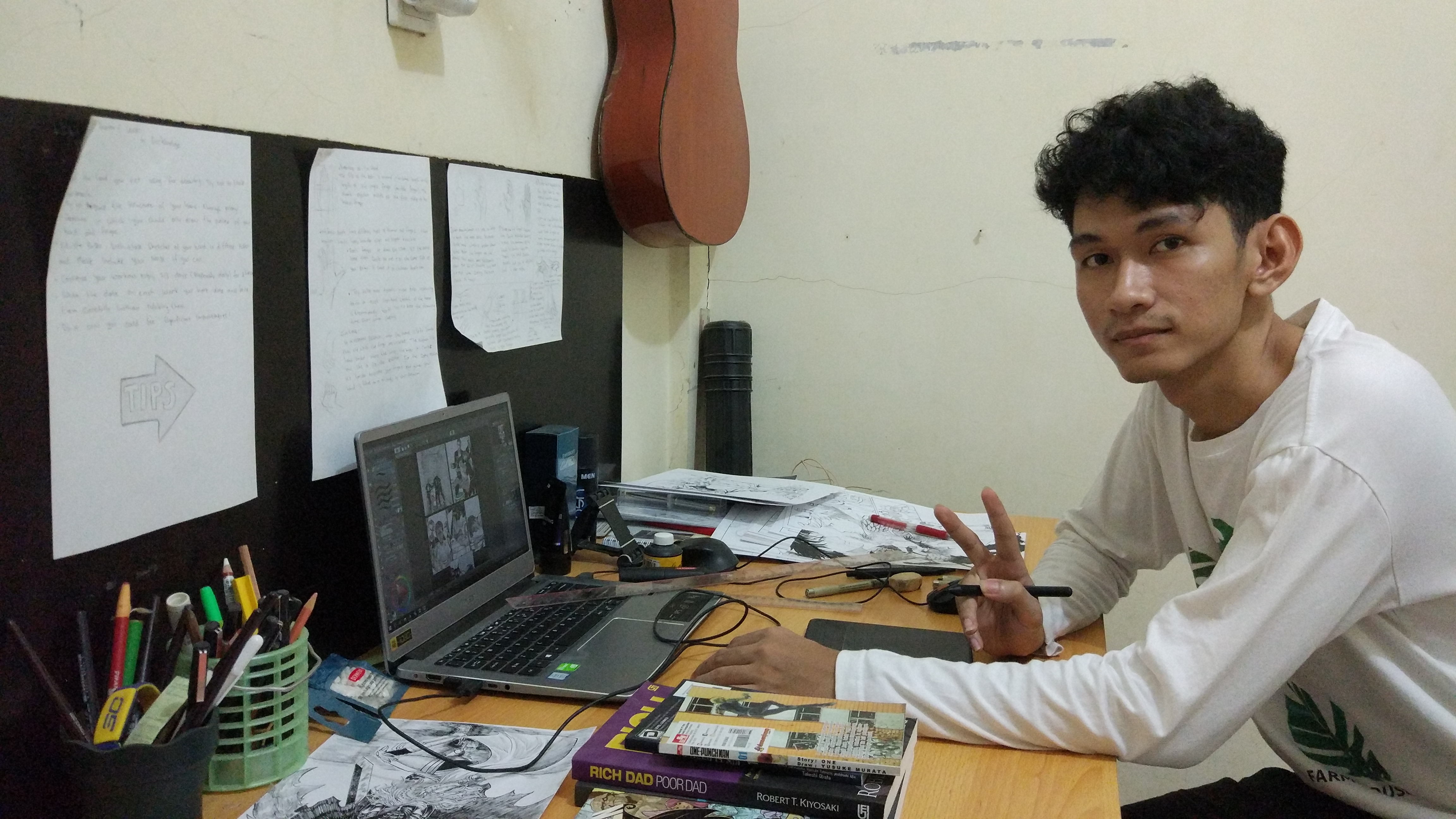 Aditya Wardana at his drawing desk
